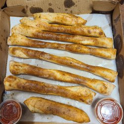 Olive Oil Pizzeria & More - Breadsticks with absolutely no cheese on them