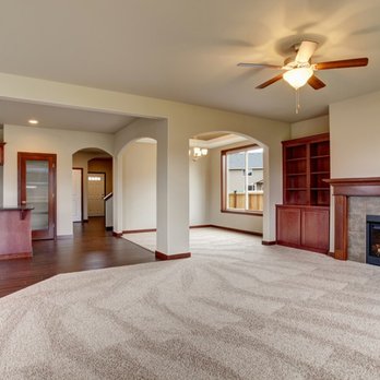Quick Floors - a living room with a fireplace - Flooring Near Me - Brooklyn Park, Minnesota Quick Floors - a living room with a fireplace - Flooring Near Me - Brooklyn Park, Minnesota