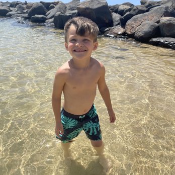 Lydgate Beach Park - He's 15 feet out and look how shallow - Parks Near Me - Kapaa, Hawaii