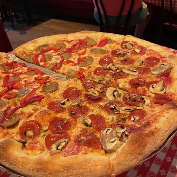 Home Slice Pizza - Large Pizza. 1/2 with Pepperoni & Mushroom, 1/2 with Roasted Red Peppers and Sausage - Pizza Near Me - Austin, Texas Home Slice Pizza - Large Pizza. 1/2 with Pepperoni & Mushroom, 1/2 with Roasted Red Peppers and Sausage - Pizza Near Me - Austin, Texas