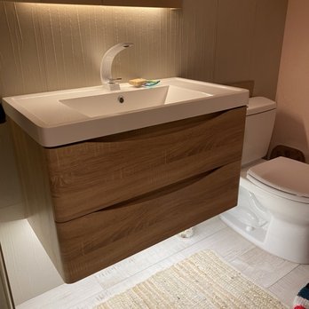 Guo Hong - a bathroom with a sink and toilet - General Contractors Near Me
