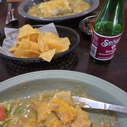 Mi Tierra - Smothered Asada burrito Cheese enchiladas with green sauce. Delicious!