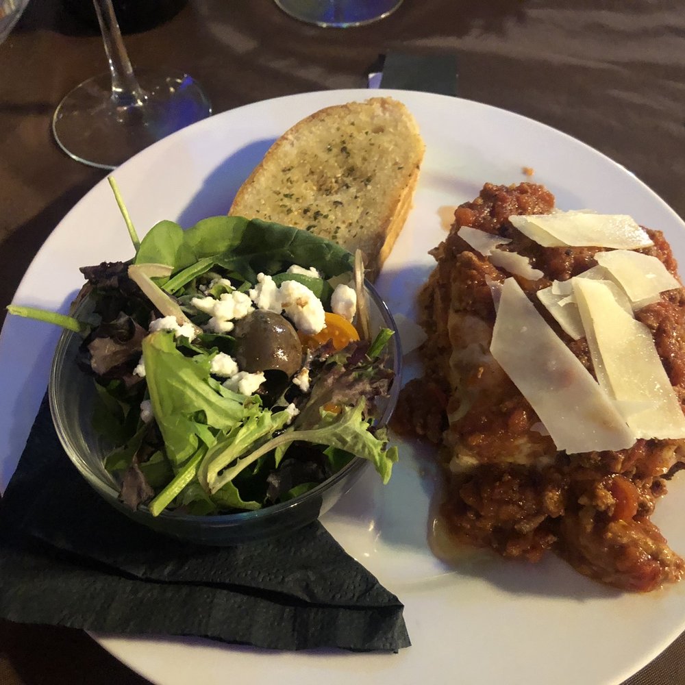Fat Cat Lounge and Cafe - Lasagna w/ side salad and garlic bread - Wine Bars Near Me - Smithville, Texas
