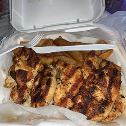Royal Barbecue - 2 Pc Grilled Chicken Dinner and fries I always ask to get mine cooked longer that's why it's darker great food always