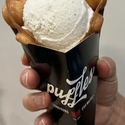 Waffle cone with one scoop of ice cream