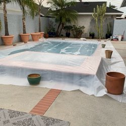 Mike Killeen Quality Roofing - Part of the preparation is to cover everything ,such as our pool from debris.