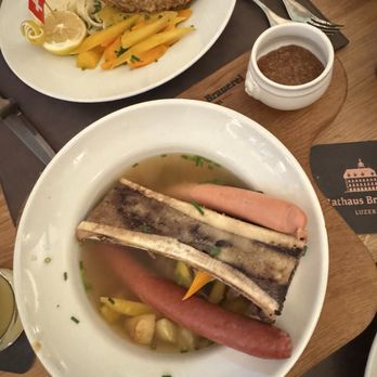 Rathaus Brauerei - "Ratskellertopf" Juicy beef shoulder filet, bone marrow, frankfurter and Rathaus beer sausages - Breweries Near Me - Luzern, LU Rathaus Brauerei - "Ratskellertopf" Juicy beef shoulder filet, bone marrow, frankfurter and Rathaus beer sausages - Breweries Near Me - Luzern, LU