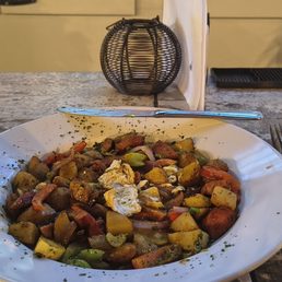 The Cajun Brunch Bowl: Andouille sausage, roasted potatoes, Cajun Trinity with mixed summer veggies in a lemon caper remoulade sauce.