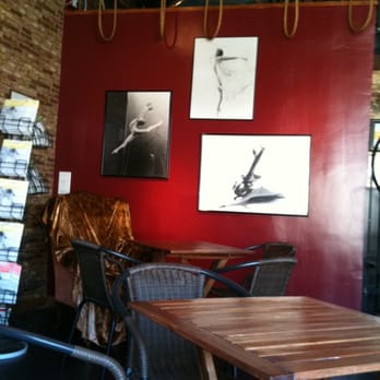Backstage Coffeehouse - a red wall with chairs and a table - Coffee & Tea Near Me - Long Beach, California Backstage Coffeehouse - a red wall with chairs and a table - Coffee & Tea Near Me - Long Beach, California