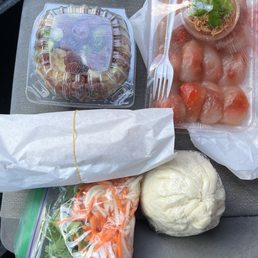 Food to go: Vietnamese banh mi, shrimp tapioca dumplings, pork bun, and rice & Chinese sausage. Food to go: Vietnamese banh mi, shrimp tapioca dumplings, pork bun, and rice & Chinese sausage.