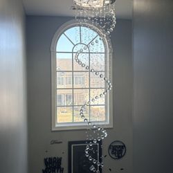 Anderson Electrical - Tall Foyer with a Raindrop Chandelier.