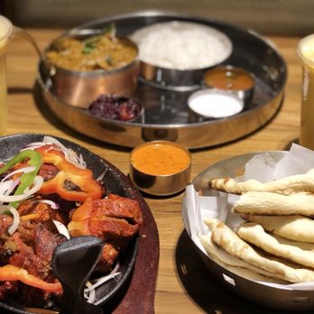 Southern Spice - Garlic naan, chettinaad chicken served along rice, gravy, rasam, raitha and desert. So impressive. - Indian Near Me - Irvine, California Southern Spice - Garlic naan, chettinaad chicken served along rice, gravy, rasam, raitha and desert. So impressive. - Indian Near Me - Irvine, California