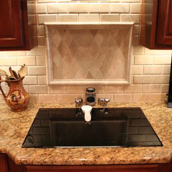 Ubatuba Granite Countertops With Travertine Tile Backsplash Yelp