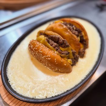 Champagne Poetry - Japanese sizzling Wagyu cheeseburger - Champagne Bars Near Me - Portland, Oregon Champagne Poetry - Japanese sizzling Wagyu cheeseburger - Champagne Bars Near Me - Portland, Oregon