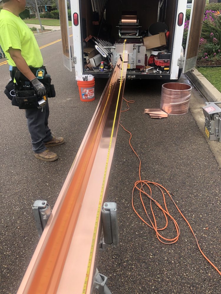 Slide of Escamilla’s Roofing and Rain Gutters