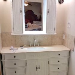 Oscar’s Home Improvements - Flooring, backsplash, vanity installation, sink installation and plumbing.