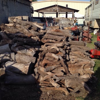 Wagon Wheel BBQ - The woodpile -- lots of oak and mesquite - Barbeque Near Me - Ozona, Texas