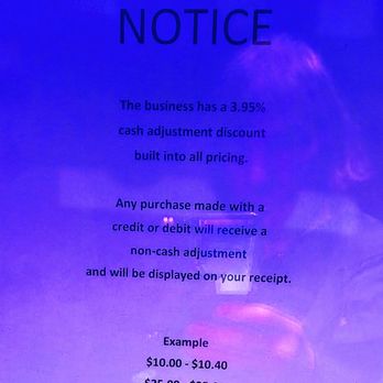 Dusal's - This is posted on the Front door. which is Required by law. However the 3.95% is Questionable! - A sign explains a 3.95% cash adjustment discount and how credit or debit purchases will receive a non-cash adjustment, with examples. - Pizza Near Me - Kendall Park, New Jersey