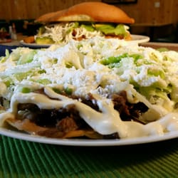 Guacamole Mexican Cuisine - 3 enchiladas filled with seasoned chicken or beef. Topped with melted Oaxaca cheese, avocado and chopped onions. Cover with green salsa, red