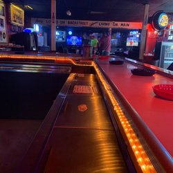 Backstreet Tavern - 5pm Wednesday. $2 Bud Lights. Lots of ashtrays and smells like it.