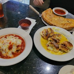 Garlic knots with cheese and pepperoni, meat lasagna, and the meat lovers calzone