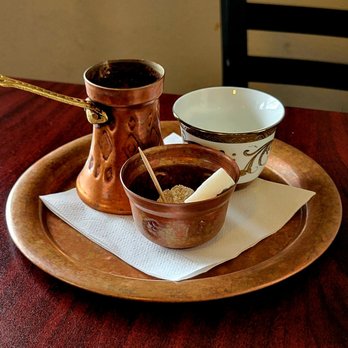 Balkan Cafe & Grill - Turkish Coffee. It's unfiltered meant to be sipped. It's served with hard sugar and some jelly candy. - Modern European Near Me - Austin, Texas