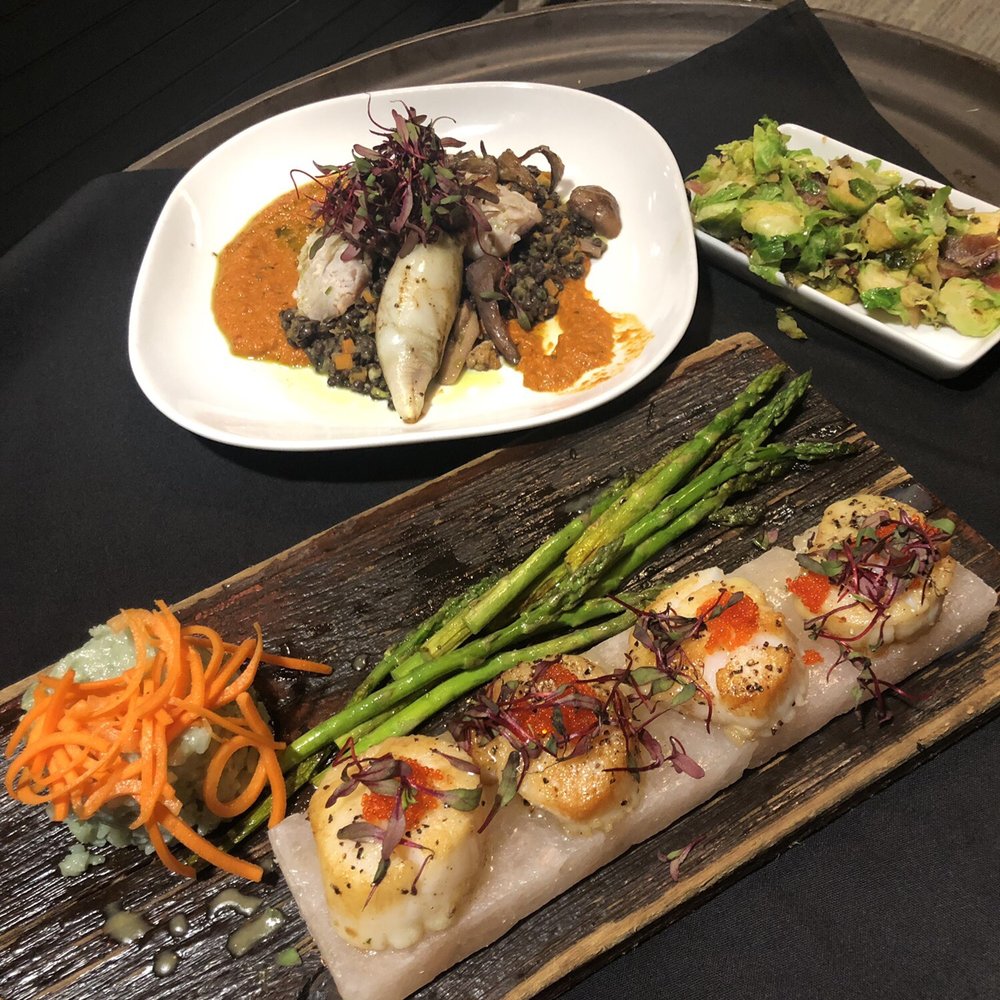 Preston's - Seafood Duo: Grilled squid stuffed w chorizo, lobster butter poached snapper, vodka sauce. Scallops w bamboo rice risotto and asparagus. - Cocktail Bars Near Me - Killington, Vermont