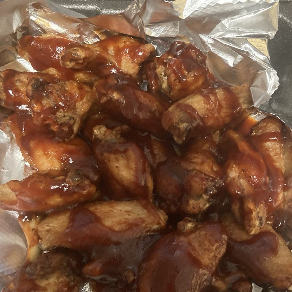 Byrd's Hot Chicken - 20 wings. Sauce drizzled on top. It's not tossed in sauce. - Chicken Shop Near Me - Skokie, Illinois Byrd's Hot Chicken - 20 wings. Sauce drizzled on top. It's not tossed in sauce. - Chicken Shop Near Me - Skokie, Illinois