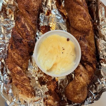 The Pizza Place - Cinnamon twisted stick and the best dip ever. - Pizza Near Me - Lusk, Wyoming The Pizza Place - Cinnamon twisted stick and the best dip ever. - Pizza Near Me - Lusk, Wyoming