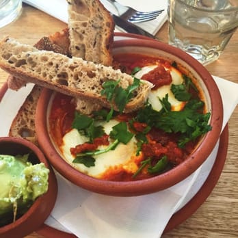 Room for a Pony - Baked eggs with a side of avocado - served in bowls and plates hand made by a friend of the business!! - Cafes Near Me - North Hobart, TAS