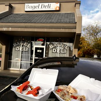 Bagel Deli - Front entrance. Simple yet nostalgic! I got the 11. Lox Sandwich on an Onion Bagel and 8. Garden Bagel Sandwich on a Poppy Seed Bagel. - Bakeries Near Me - Redding, California