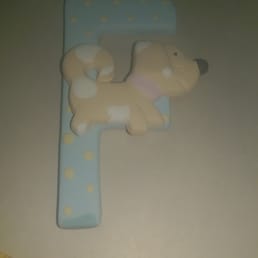 My finished product pre-glaze. For an extra $.40, they made it a magnet for me!