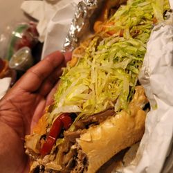 Al's Steak House - I took a couple of bites out of these cheese steak and it was so good...11 more inches of steak to go!