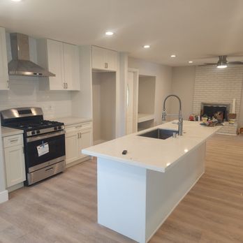 Quintero & Hakimi Builders - a kitchen with a stove, sink, oven, and refrigerator - General Contractors Near Me Quintero & Hakimi Builders - a kitchen with a stove, sink, oven, and refrigerator - General Contractors Near Me