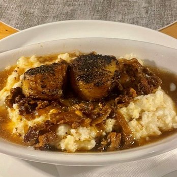Off the Hook - The scallop appetizer. Two scallops on grits with bacon. $19 for two 16/20 grade scallops. - Seafood Near Me - Bethany Beach, Delaware Off the Hook - The scallop appetizer. Two scallops on grits with bacon. $19 for two 16/20 grade scallops. - Seafood Near Me - Bethany Beach, Delaware