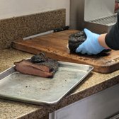 Photo of Post Oak Barbecue - Sacramento, CA, United States. Brisket being cut as we ordered