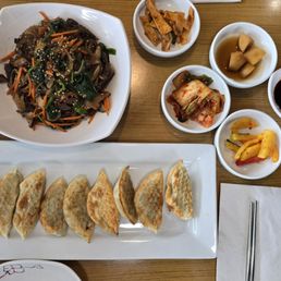 Japchae, Fried Dumplings and ban chan (side dishes) Japchae, Fried Dumplings and ban chan (side dishes)