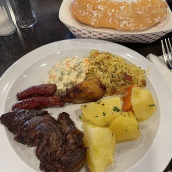 Brazilian Grill & Bakery - From the salad bar & grill. Sweet baked good in back that's filled with cheese and topped with condensed milk and coconut - Brazilian Near Me - Columbus, Ohio