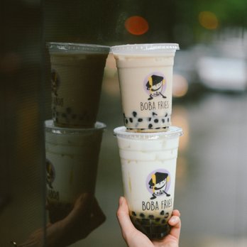 Boba Fries - a hand holding two cups of boba milk - Bubble Tea Near Me - Elmhurst, New York