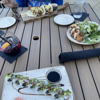 Hangar Kitchen Plus Bar - Cod tacos, chicken Caesar salad and Ahi sushi roll. - Tacos Near Me - St. Louis, Missouri