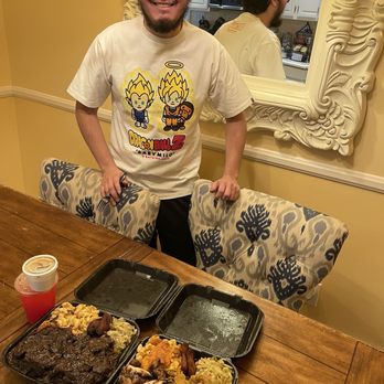 Tev's kitchen - My son Noah and his two combo plates of food. To the left, short rib plate and ox tail with greens w/ best mac n cheese on this planet. - Soul Food Near Me - Los Angeles, California Tev's kitchen - My son Noah and his two combo plates of food. To the left, short rib plate and ox tail with greens w/ best mac n cheese on this planet. - Soul Food Near Me - Los Angeles, California
