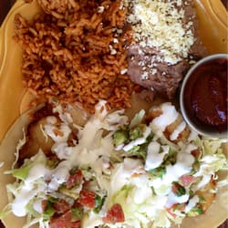 El Sabor - Fish tacos at El Sabor with a side of AMAZING Mole Sauce. YOWZA!