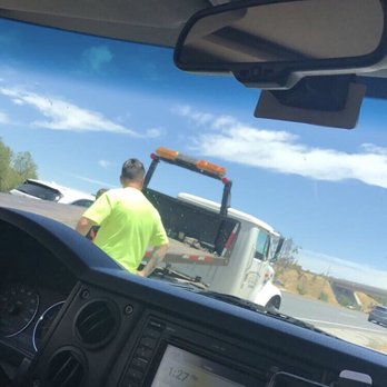 Sanchez Towing - That's my hubby speaking to the tow driver. My husband came to my rescue also but it was Sanchez Towing who saved the day! - Towing Near Me - Moreno Valley, California