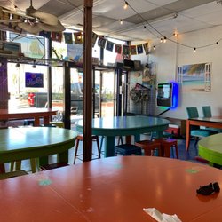 The Ocean Floor Bar & Grill - Colorful tables indoor dining