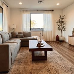 Brandi R Levy - Breezy living room in Prescott, Arizona mixing modern with rustic.