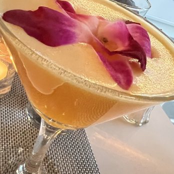 Nisi Estiatorio - I forget the name of this cocktail, but it was delicious... something about a sunrise with a mezcal base. - Greek Near Me - Astoria, New York