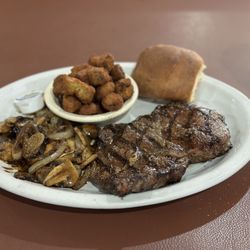 Texas Steak & Grill - 14 oz ribeye steak with okra and mushrooms.