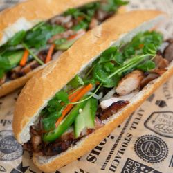 Vinh’s Banh Mi and Cafe - Crisp, airy Bánh Mì baguette loaded with smoky, marinated BBQ chicken for a flavorful fusion bite.