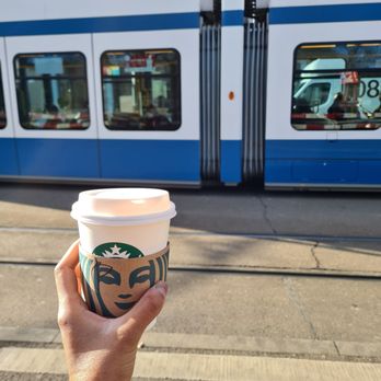 Starbucks - Cup in front of the famous Zurich trams - Coffee & Tea Near Me - Zürich, ZH Starbucks - Cup in front of the famous Zurich trams - Coffee & Tea Near Me - Zürich, ZH