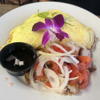 Guieb Cafe - Adobo fried rice omelette with lechon. - New American Near Me - Aiea, Hawaii